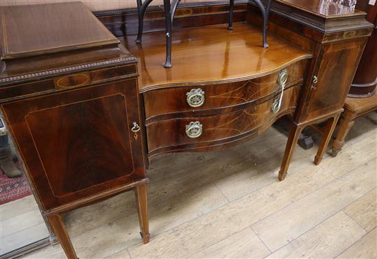 An Edwardian inlaid mahogany serpentine fronted sideboard W.167.5cm